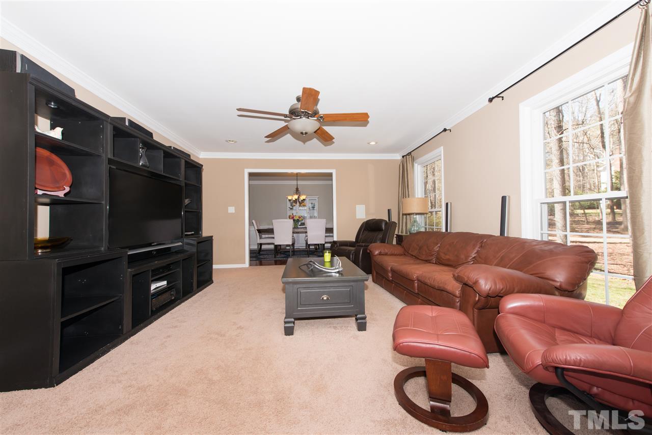 10000 Bavin Place Raleigh, NC 27613 - Photo 3 of 23 a living room with furniture and a flat screen tv