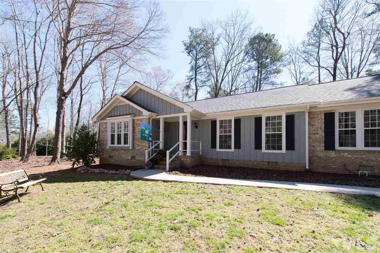 10000 Bavin Place Raleigh, NC 27613 - Photo 23 of 23 a front view of a house with yard covered in snow