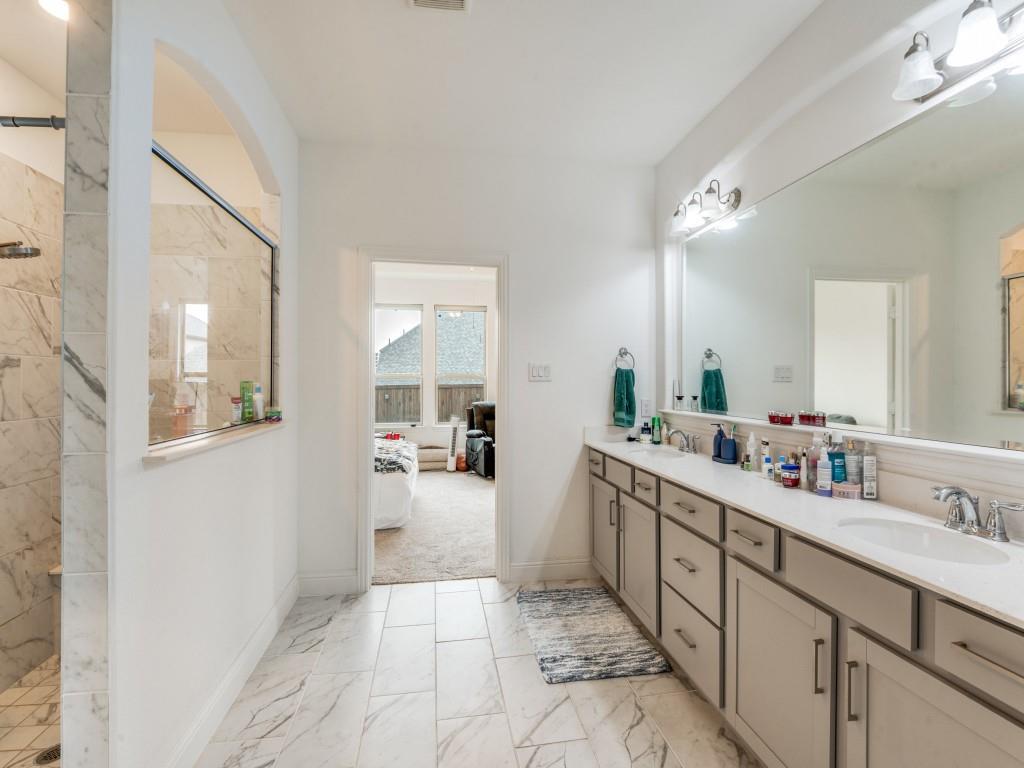 3120 Stonelake Ridge Lewisville, TX 75010 - Photo 14 of 17 a large bathroom with a double vanity sink a mirror and a bathtub