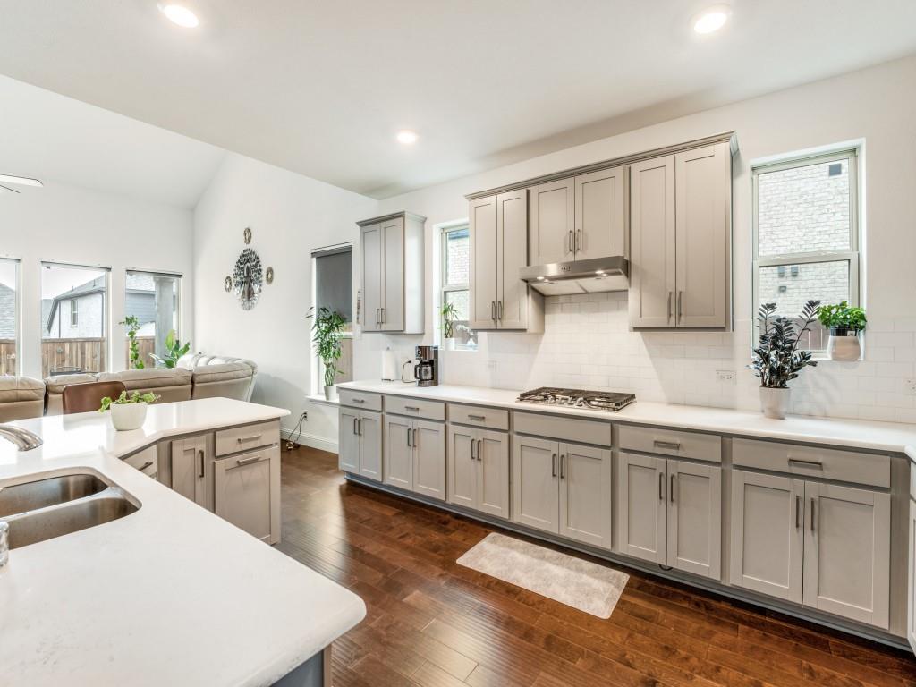 3120 Stonelake Ridge Lewisville, TX 75010 - Photo 6 of 17 a kitchen with appliances a sink and cabinets