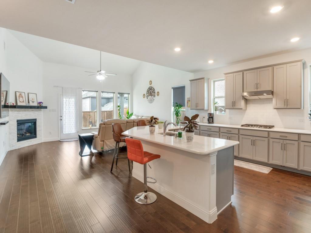 3120 Stonelake Ridge Lewisville, TX 75010 - Photo 8 of 17 a kitchen with counter top space a sink appliances and cabinets