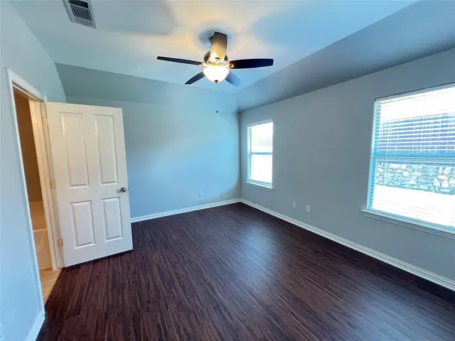 a view of livingroom with hardwood floor and a ceiling fan
