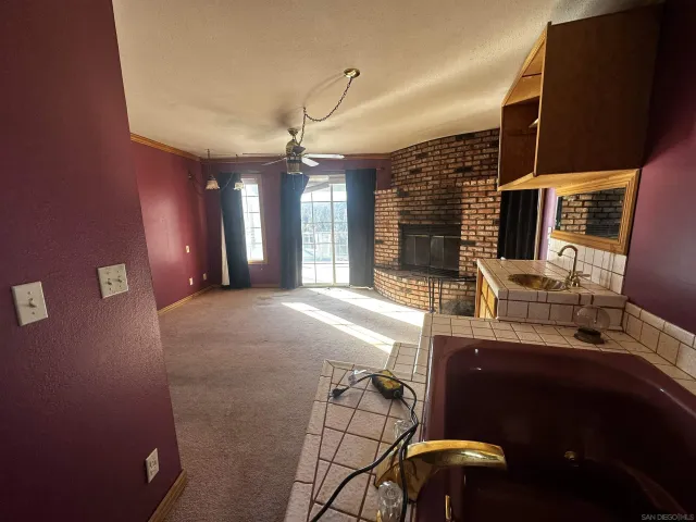 a view of a livingroom with furniture and window