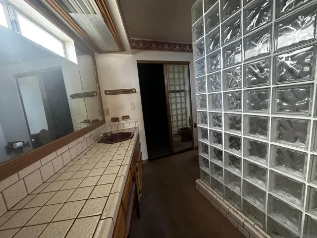 a bathroom with a double vanity sink and a mirror