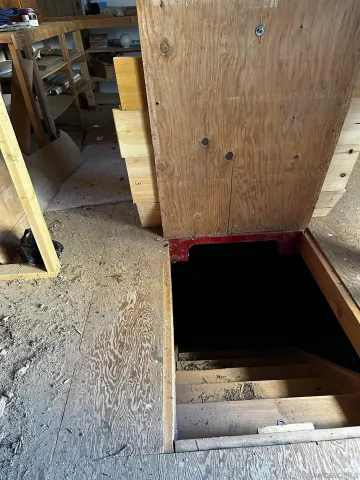 a picture of water heater room with furniture