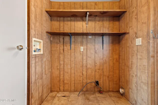 a view of a livingroom with furniture wooden floor ceiling fan and windows