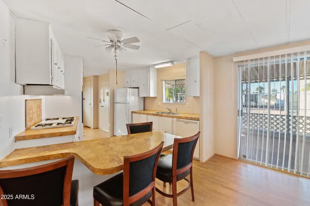 a kitchen with stainless steel appliances a stove a sink dishwasher and a refrigerator