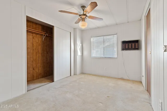 a bathroom with a granite countertop sink a toilet and bathtub
