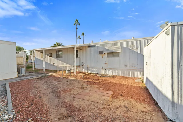 a view of a terrace with lawn chairs