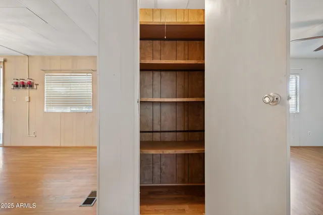 a view of a livingroom with furniture and wooden floor