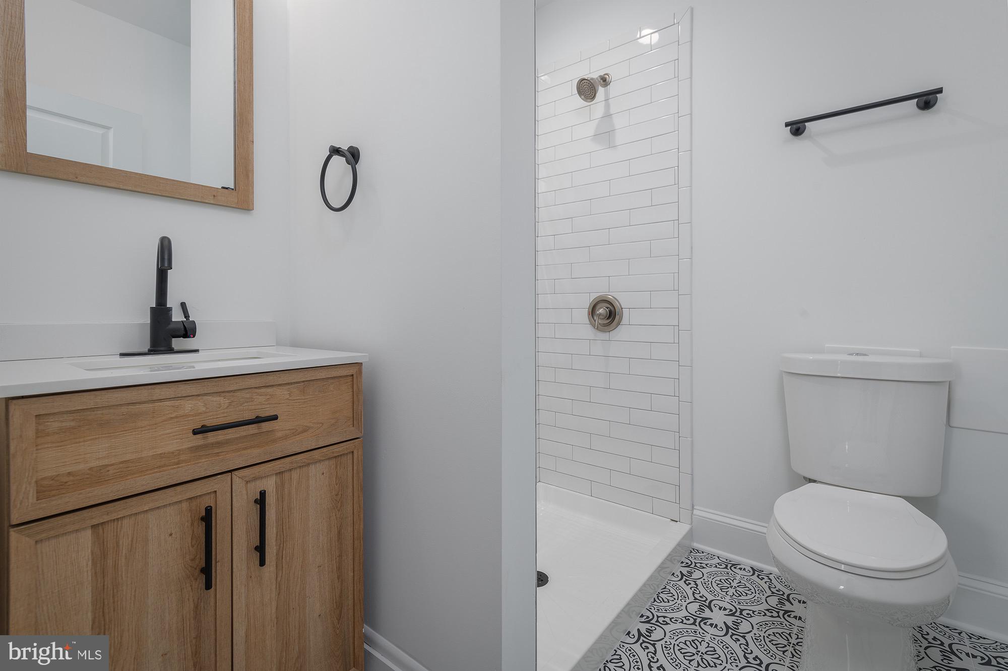 611 Plymouth Road Baltimore, MD 21229 - Photo 19 of 33 Primary Bathroom w/ Gorgeous Designer Tile