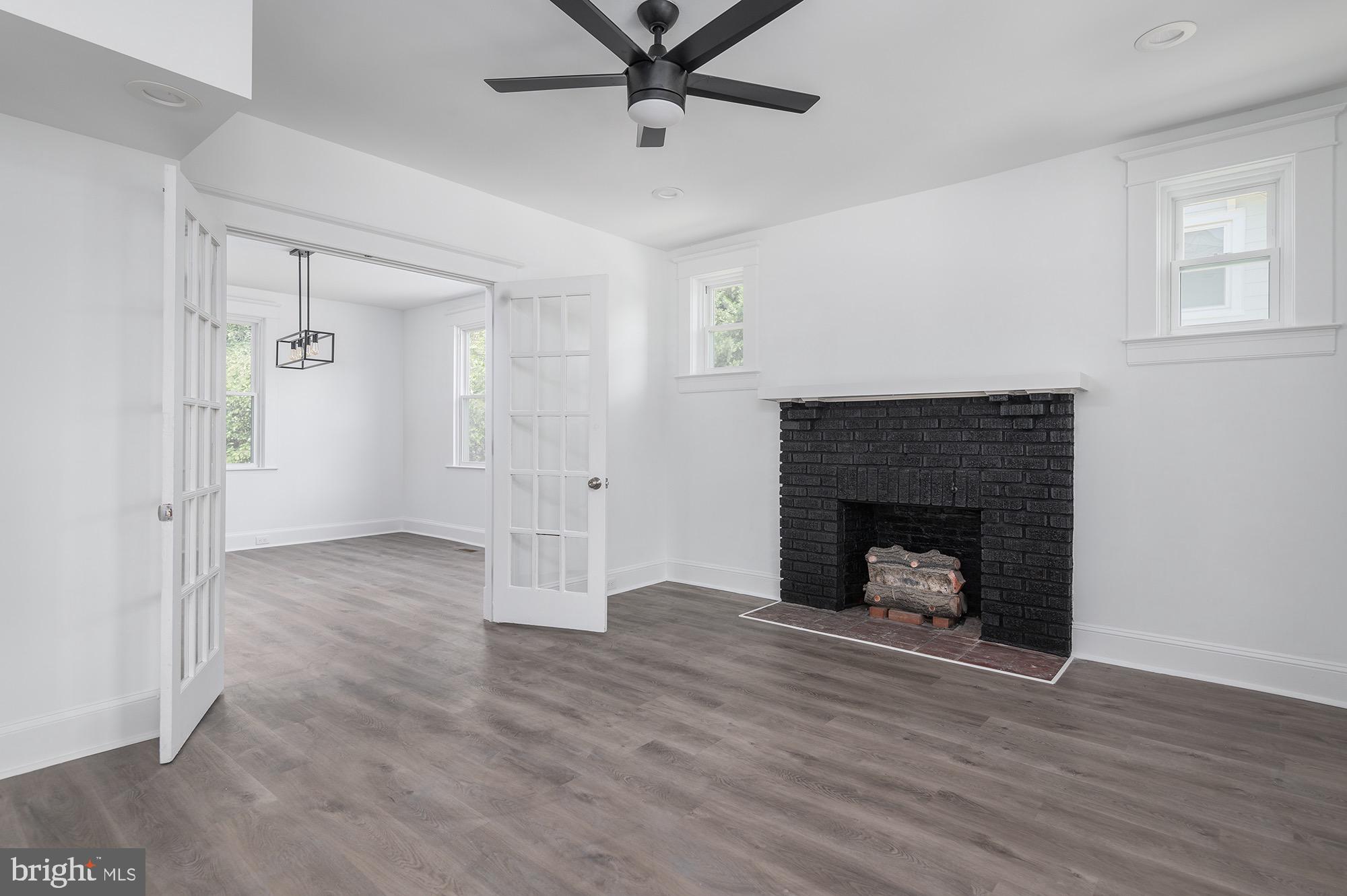 611 Plymouth Road Baltimore, MD 21229 - Photo 2 of 33 French Doors Lead to Dining Room from Living Room