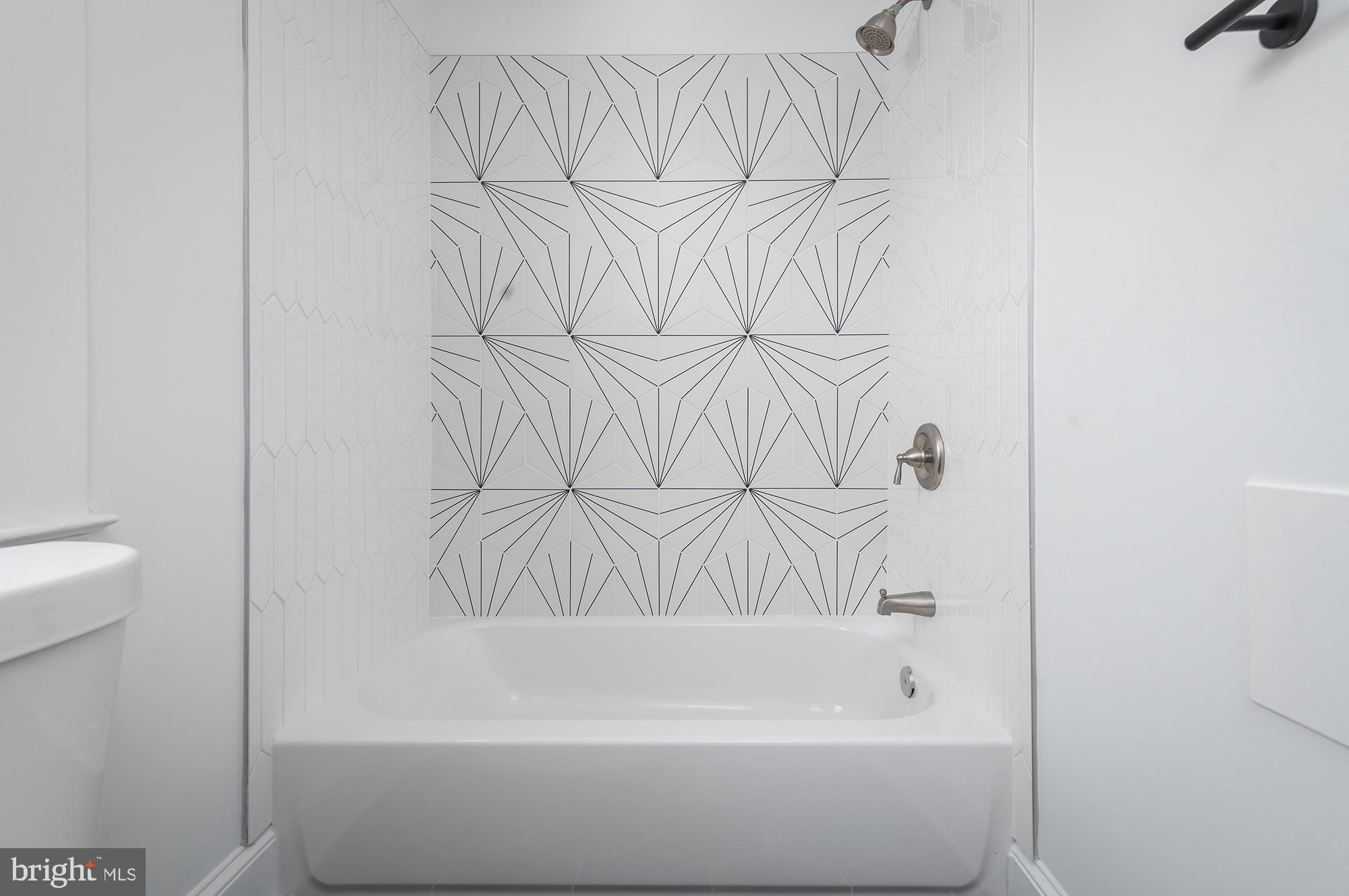 611 Plymouth Road Baltimore, MD 21229 - Photo 24 of 33 Stunning Shared Hall Bathroom w/ Designer Tile