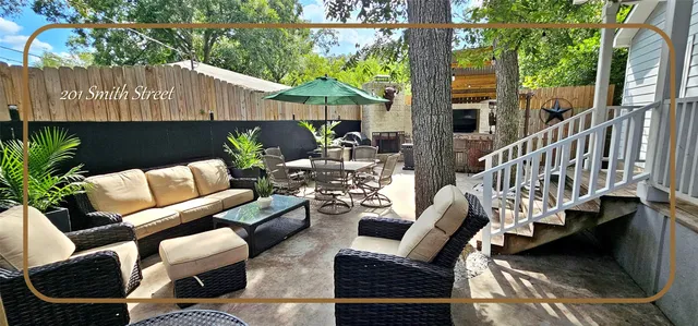 a patio with patio a couch and chairs