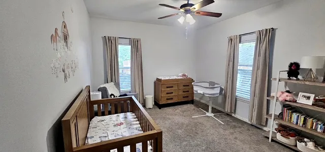 a room with furniture and a book shelf