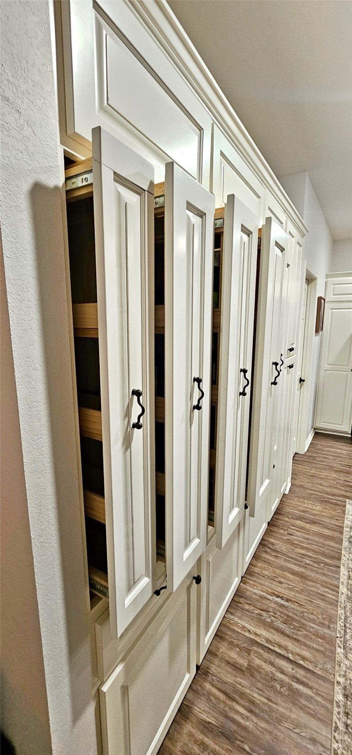 201 Smith Street Columbus, TX 78934 - Photo 8 of 20 a view of a hallway with wooden floor and staircase