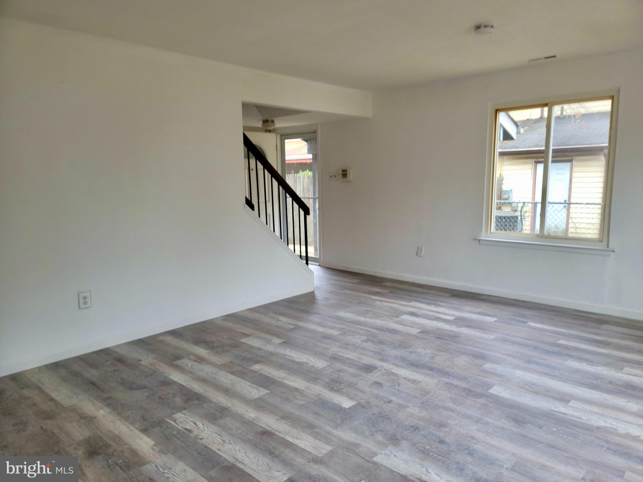 736 Myrtle Avenue Lindenwold, NJ 08021 - Photo 2 of 10 wooden floor in an empty room with a window