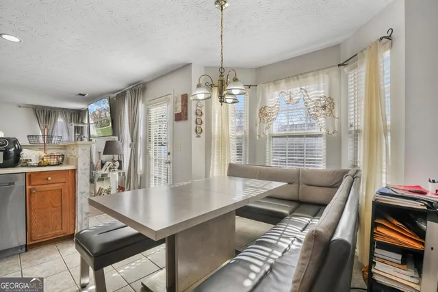a dining room with furniture and window