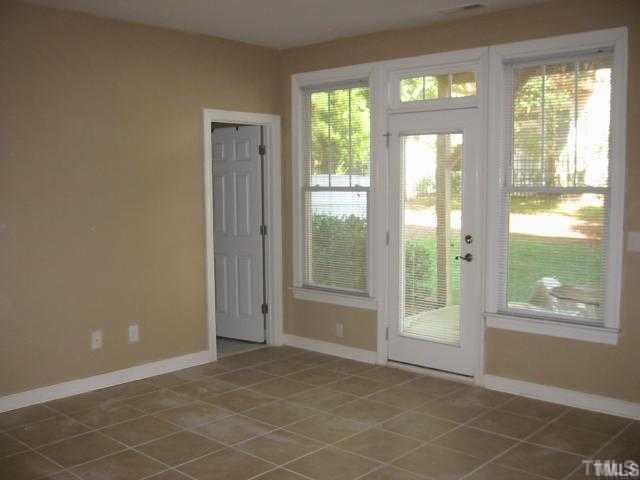 6101 Bordesley Court Raleigh, NC 27609 - Photo 3 of 6 a view of an empty room with a window