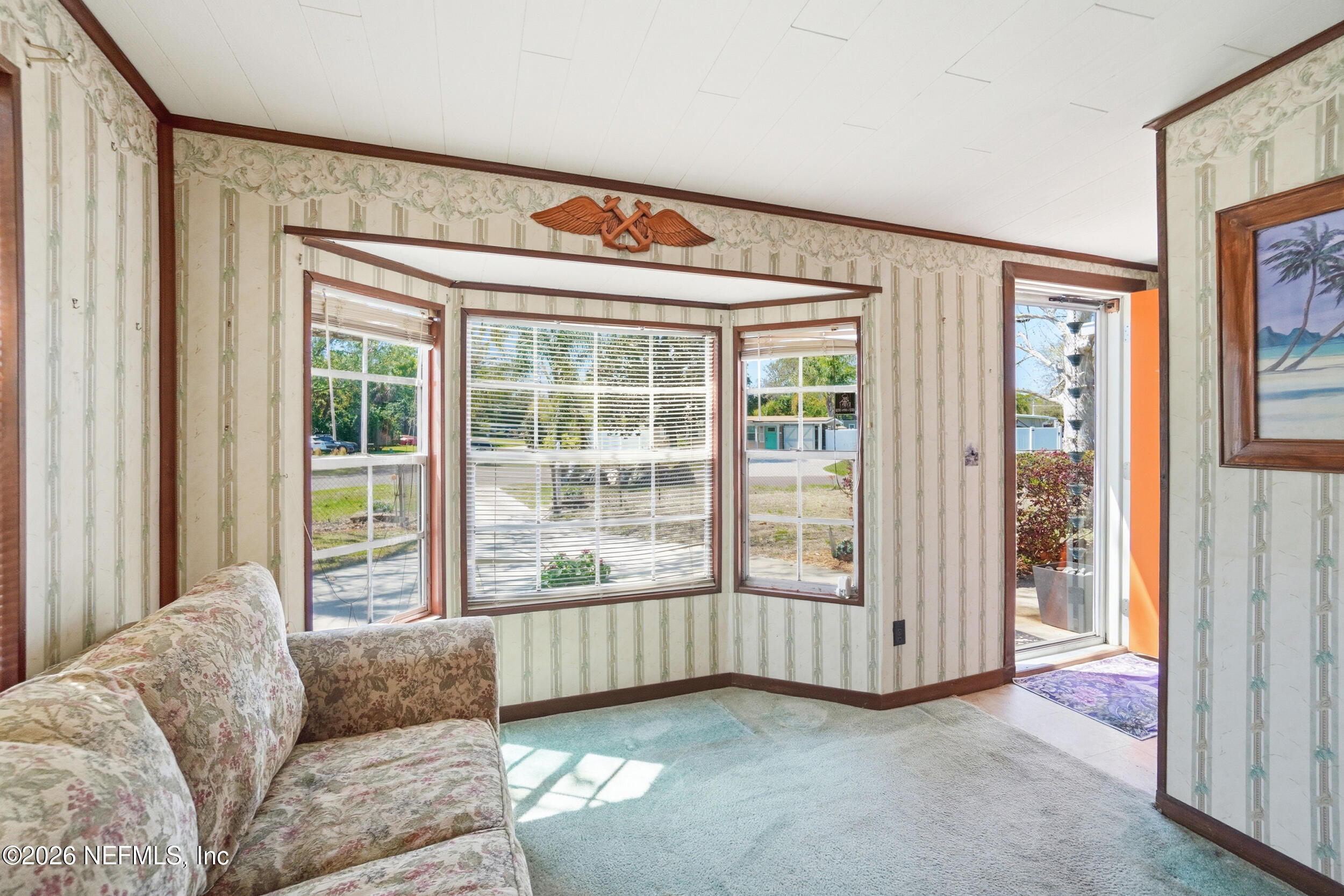43 Forrestal Circle North Atlantic Beach, FL 32233 - Photo 18 of 39 a living room with furniture and a window with outer view