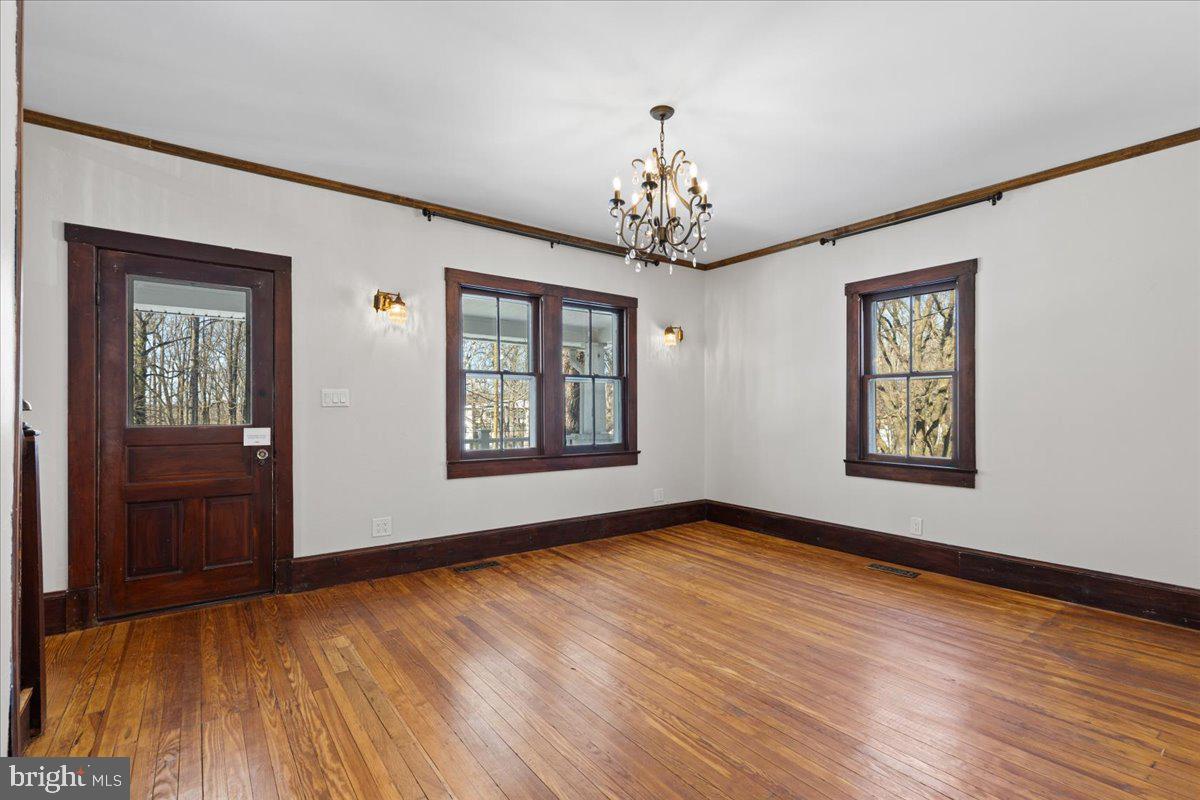 23320 Watson Road Leesburg, VA 20175 - Photo 11 of 51 a view of an empty room with a window and wooden floor