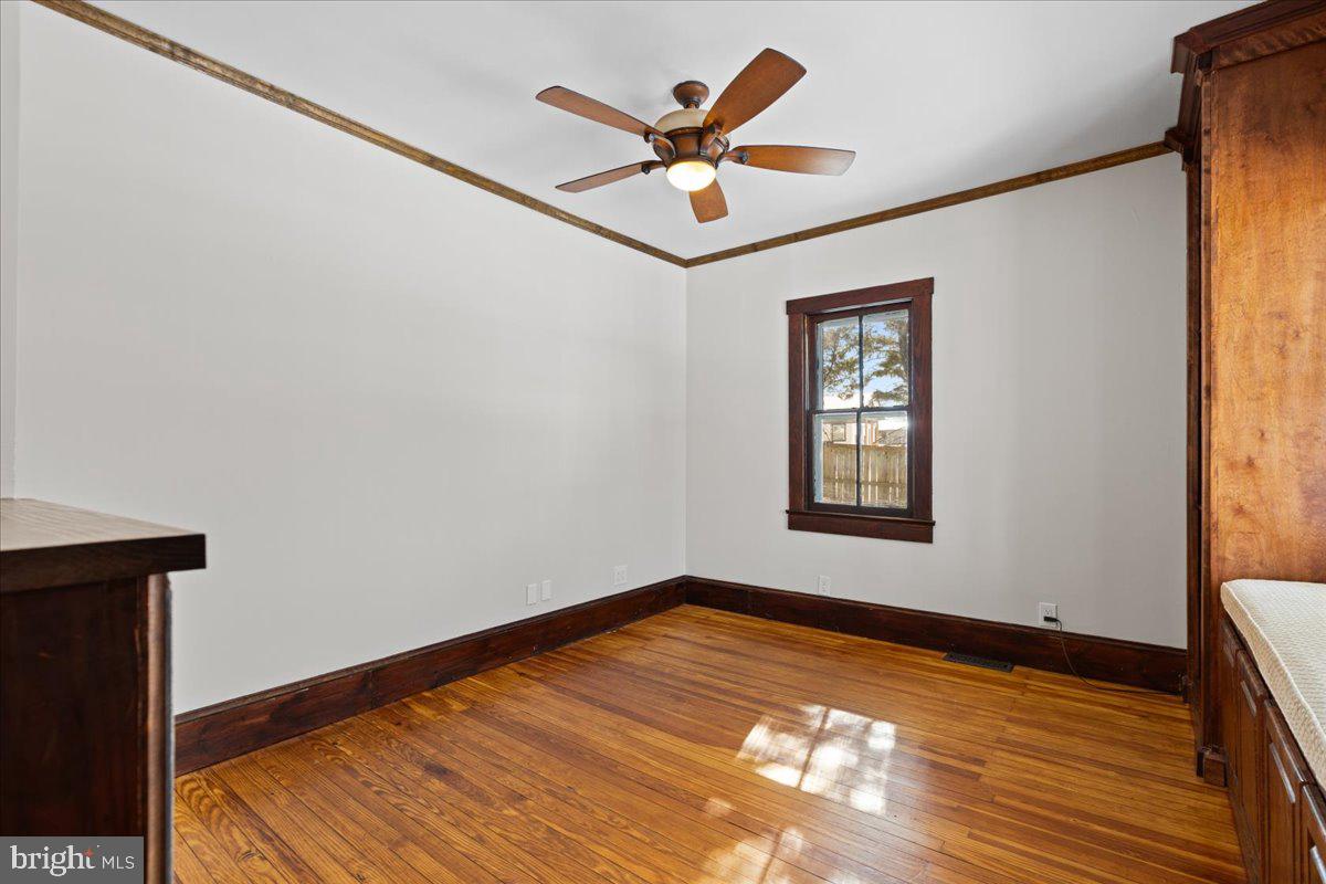 23320 Watson Road Leesburg, VA 20175 - Photo 19 of 48 a view of an empty room with window and wooden floor