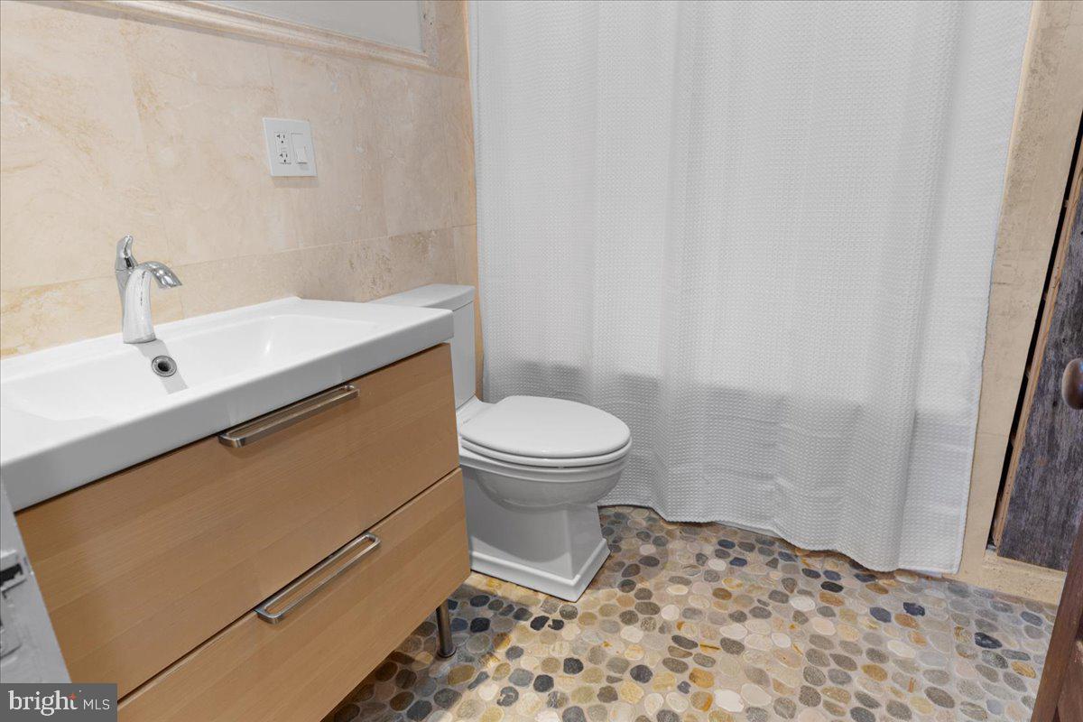 23320 Watson Road Leesburg, VA 20175 - Photo 27 of 51 a bathroom with a sink and a toilet