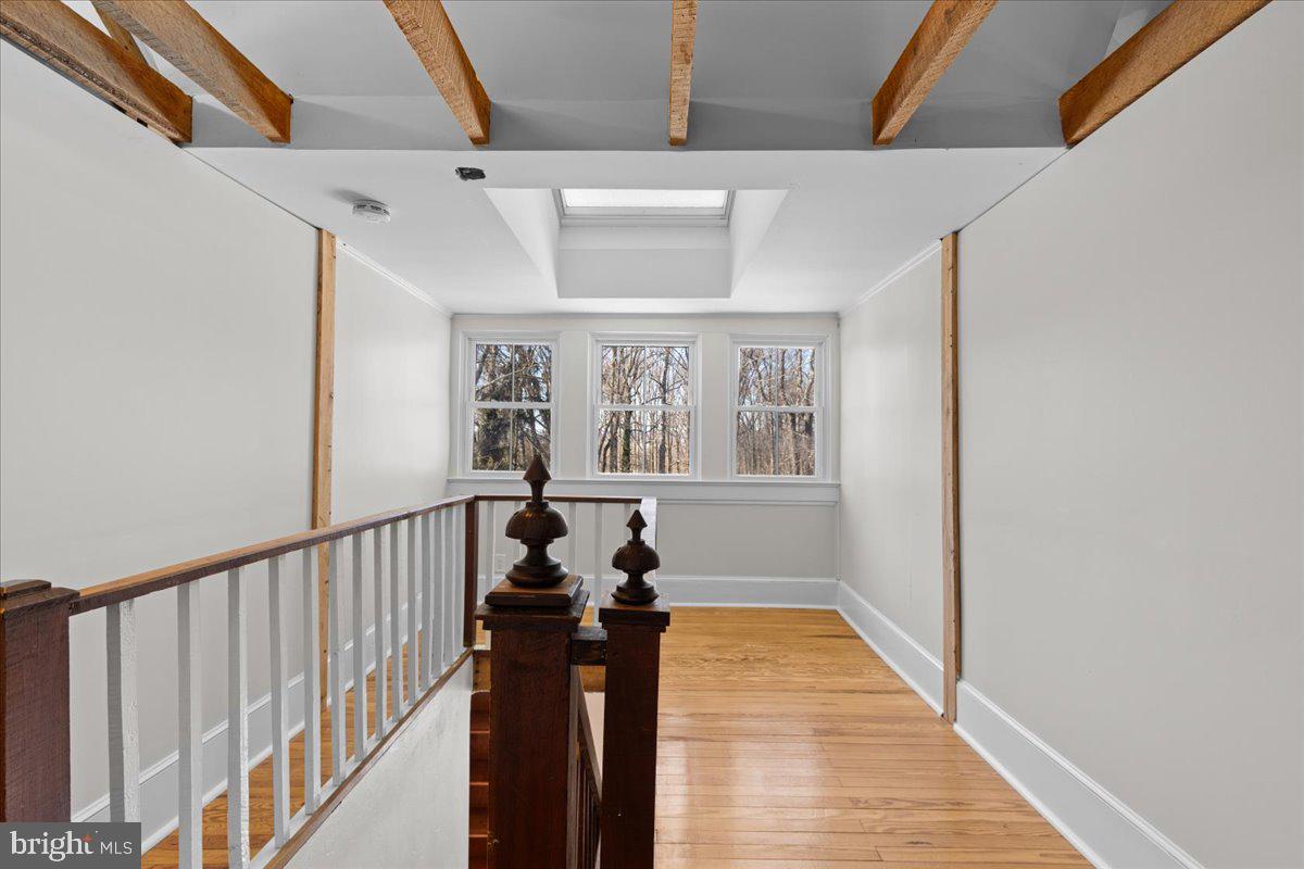 23320 Watson Road Leesburg, VA 20175 - Photo 30 of 51 a view of hallway with wooden floor and stairs