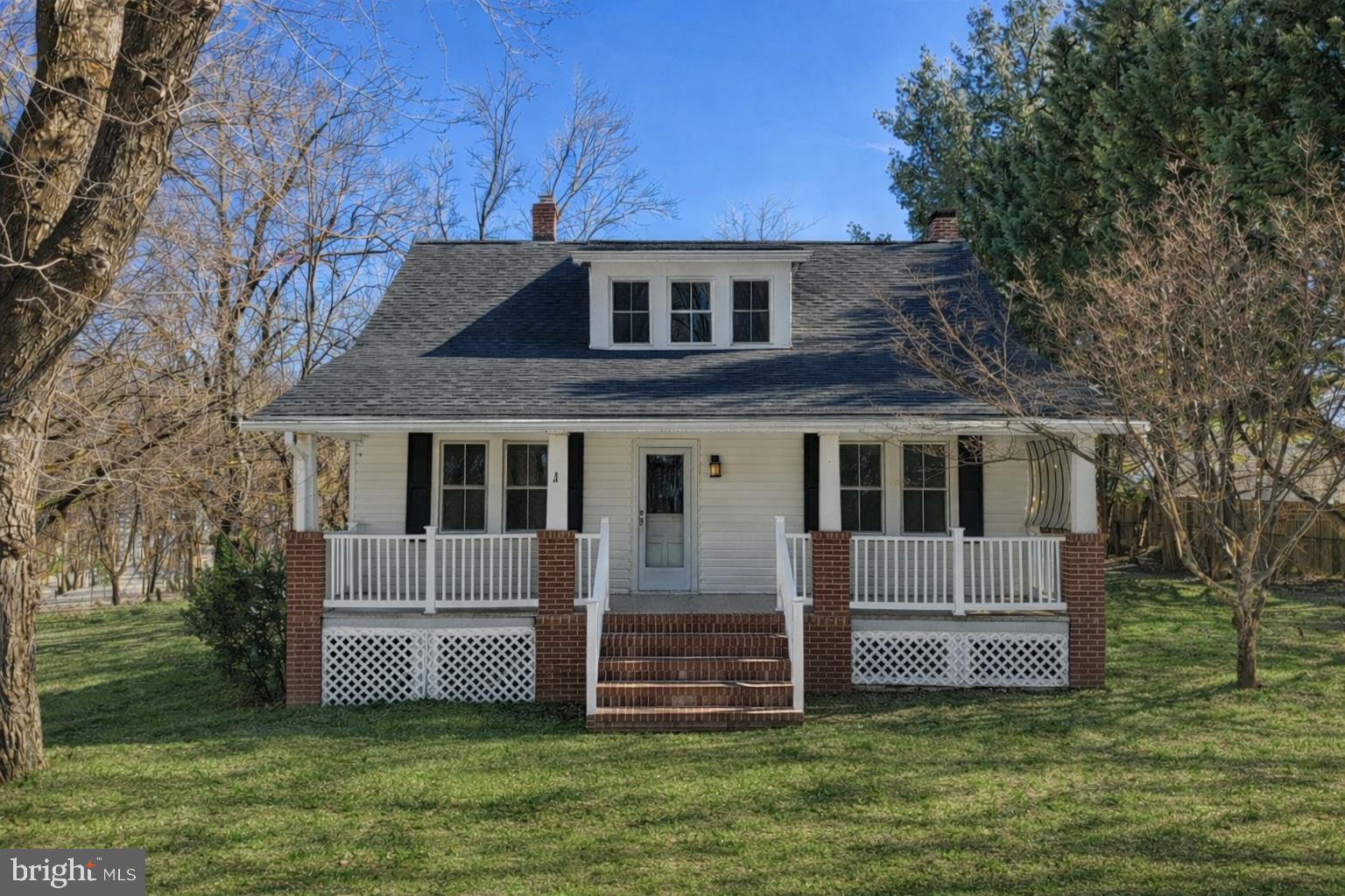 23320 Watson Road Leesburg, VA 20175 - Photo 3 of 51 a front view of a house with a garden