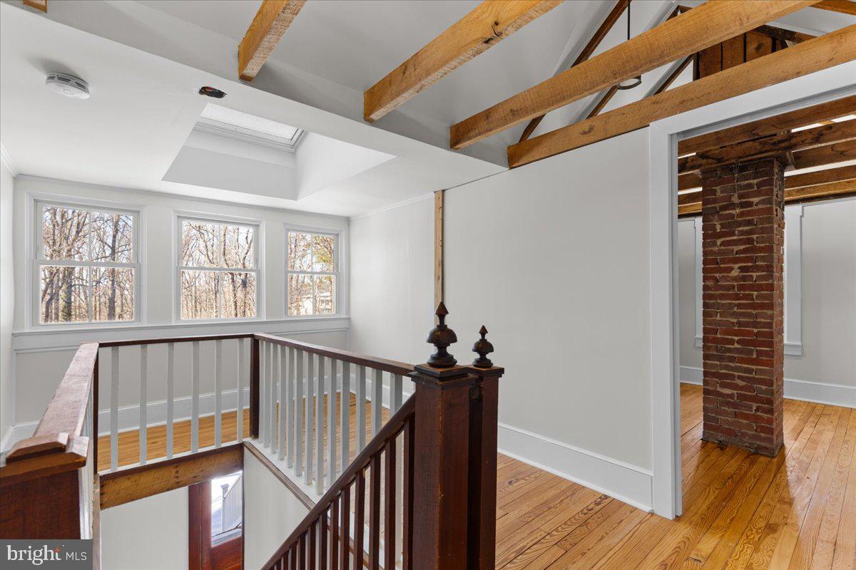 23320 Watson Road Leesburg, VA 20175 - Photo 31 of 48 upper level loft w/ skylight and exposed beams