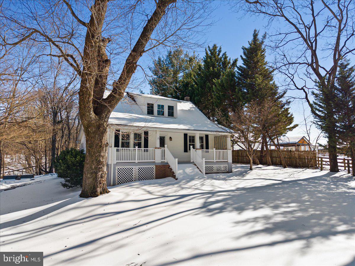 23320 Watson Road Leesburg, VA 20175 - Photo 42 of 51 a front view of a house with a garden