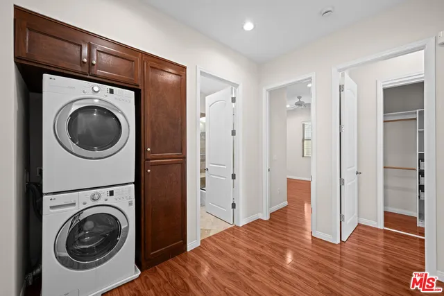 a view of a bedroom with washer and dryer