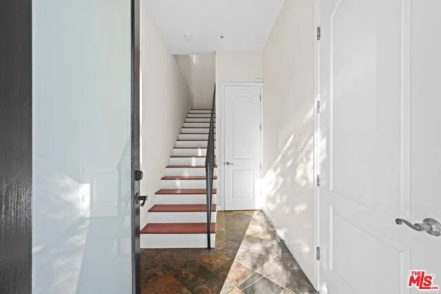 a view of entryway with wooden floor