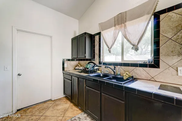 a kitchen with a stove and a microwave