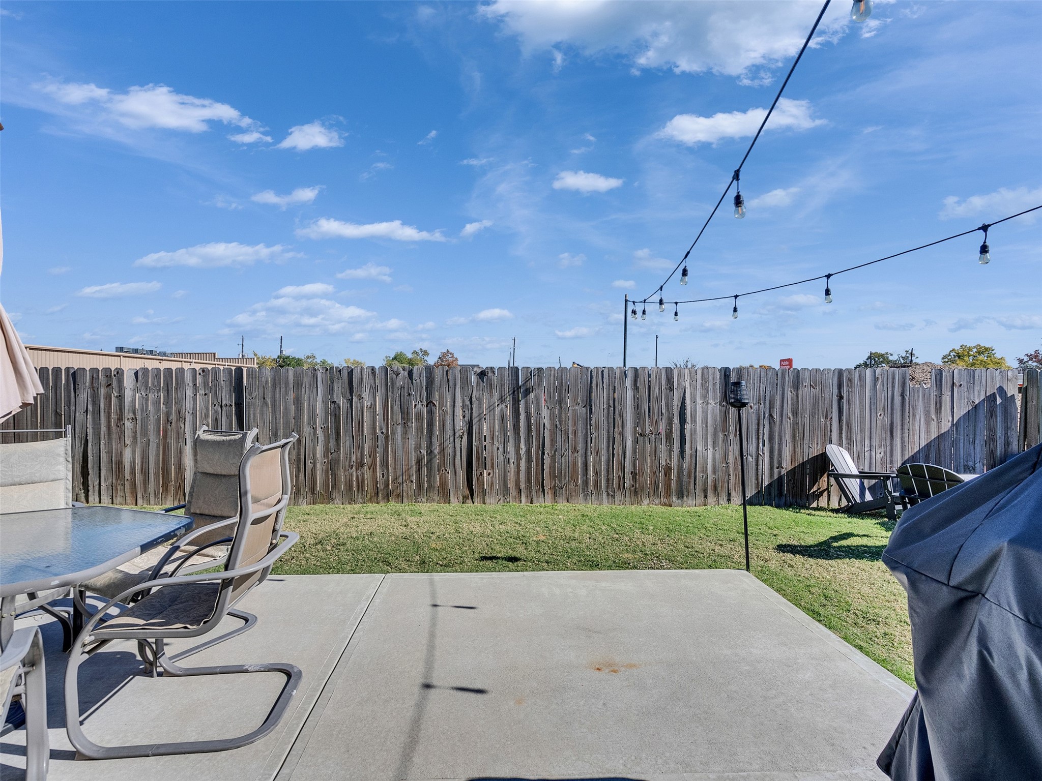 5702 Rucio Lane Houston, TX 77092 - Photo 26 of 30 Expansive concrete patio perfect for weekend BBQs and outdoor lounging.