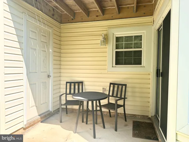 a view of a balcony with chairs