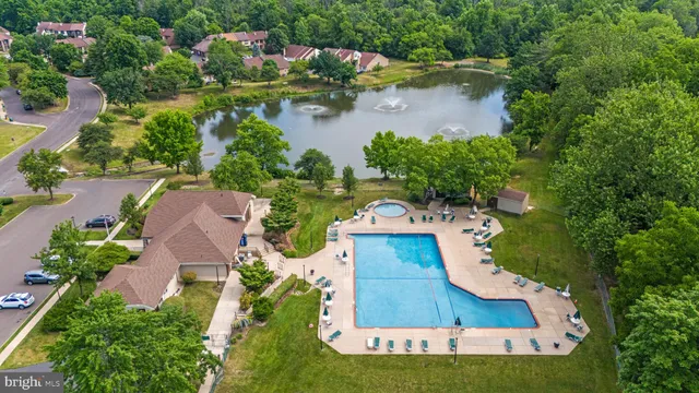 an aerial view of a house with outdoor space and lake view