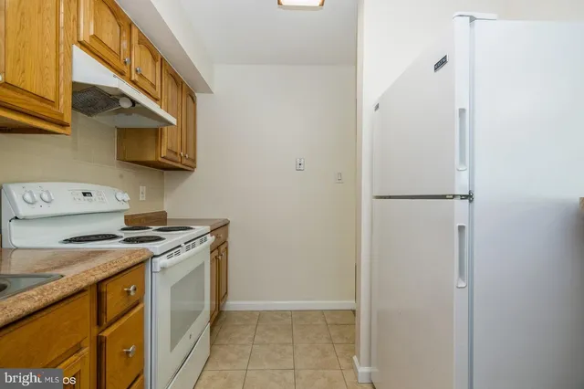 a kitchen with a stove and a microwave