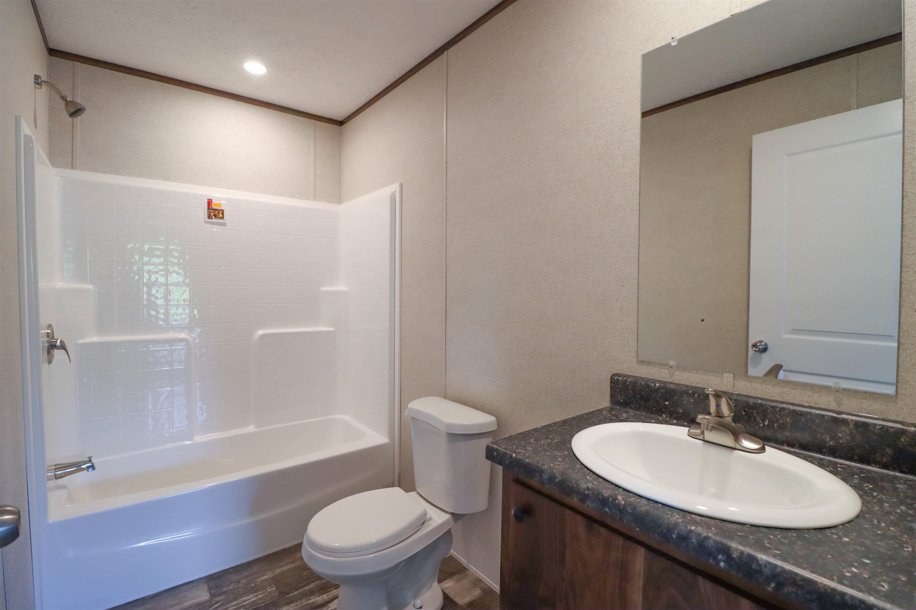 6483 Hwy 19 Highway West Ripley, TN 38063 - Photo 19 of 33 a bathroom with a granite countertop sink toilet and shower