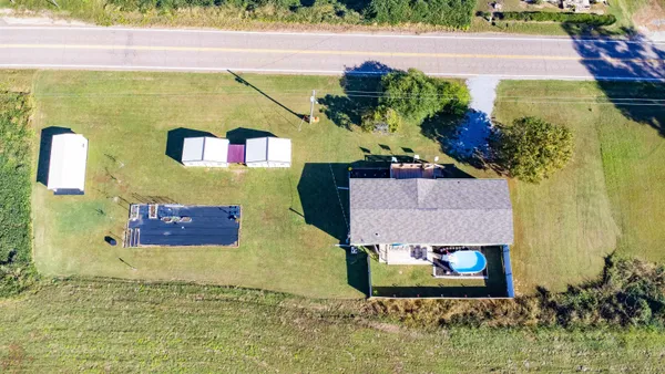 an aerial view of residential houses with outdoor space