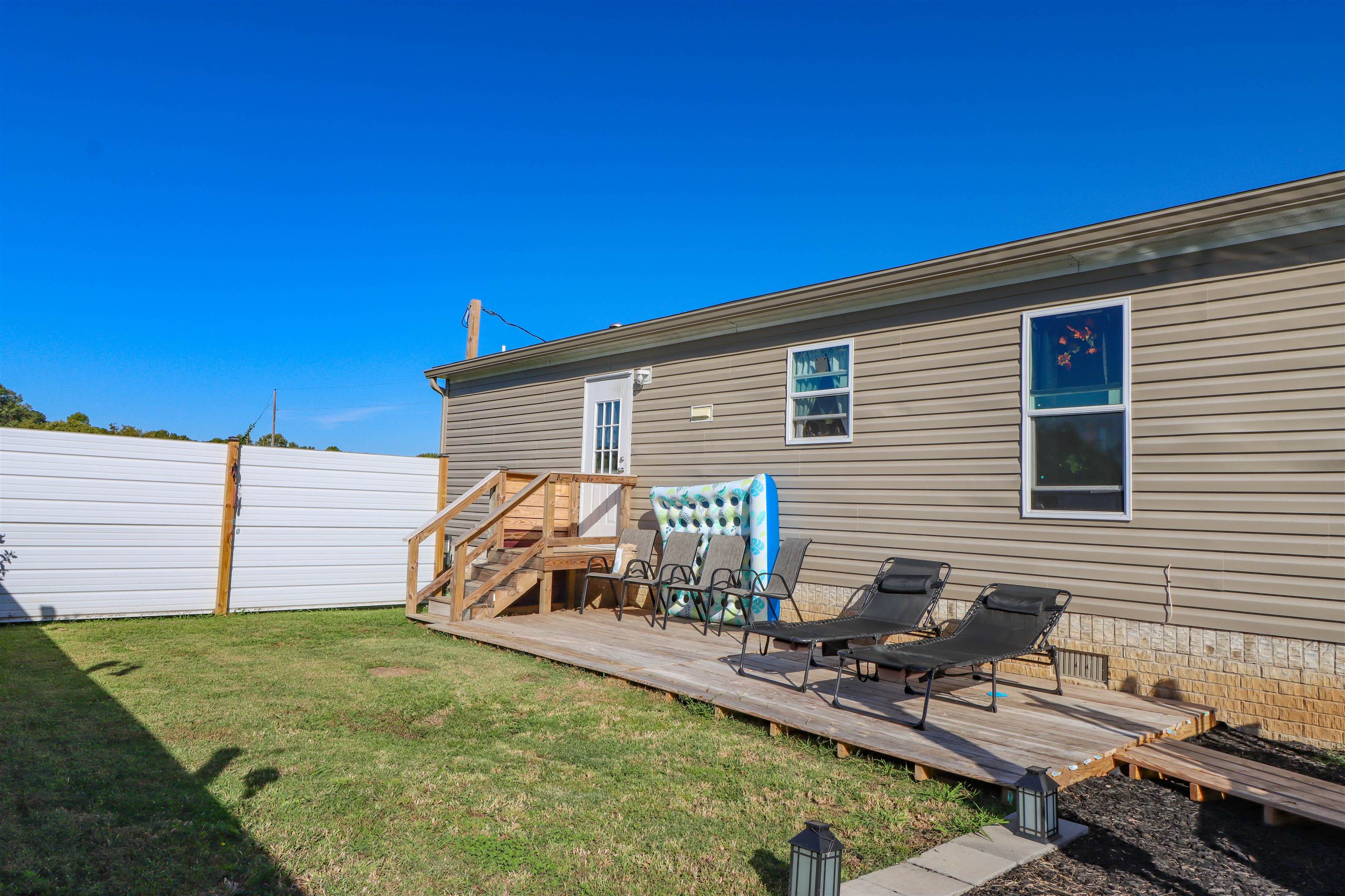 6483 Hwy 19 Highway West Ripley, TN 38063 - Photo 29 of 33 a view of a house with backyard and sitting area
