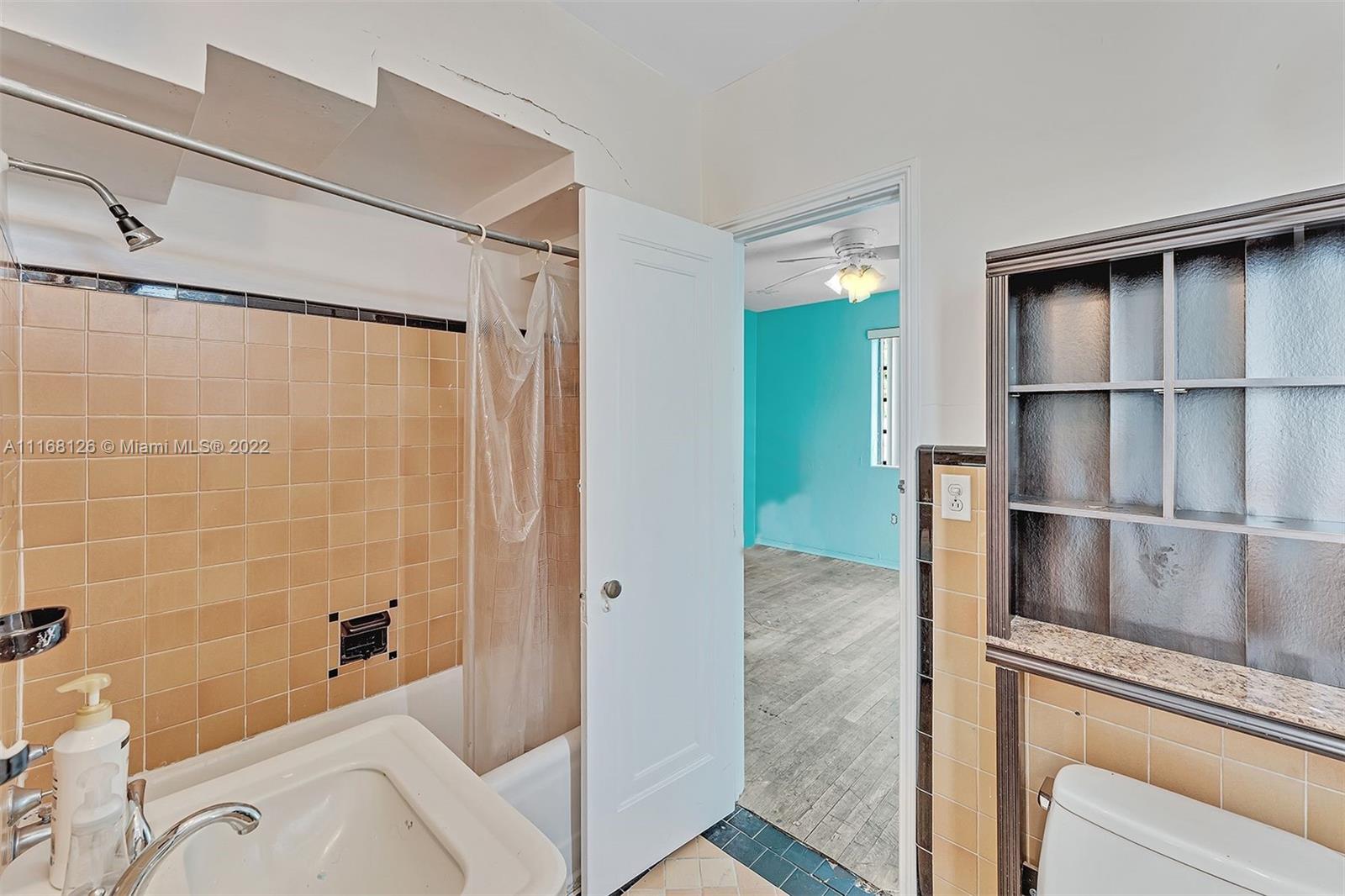 2033 North Bay Road Miami Beach, FL 33140 - Photo 20 of 38 a bathroom with a bathtub and a shower