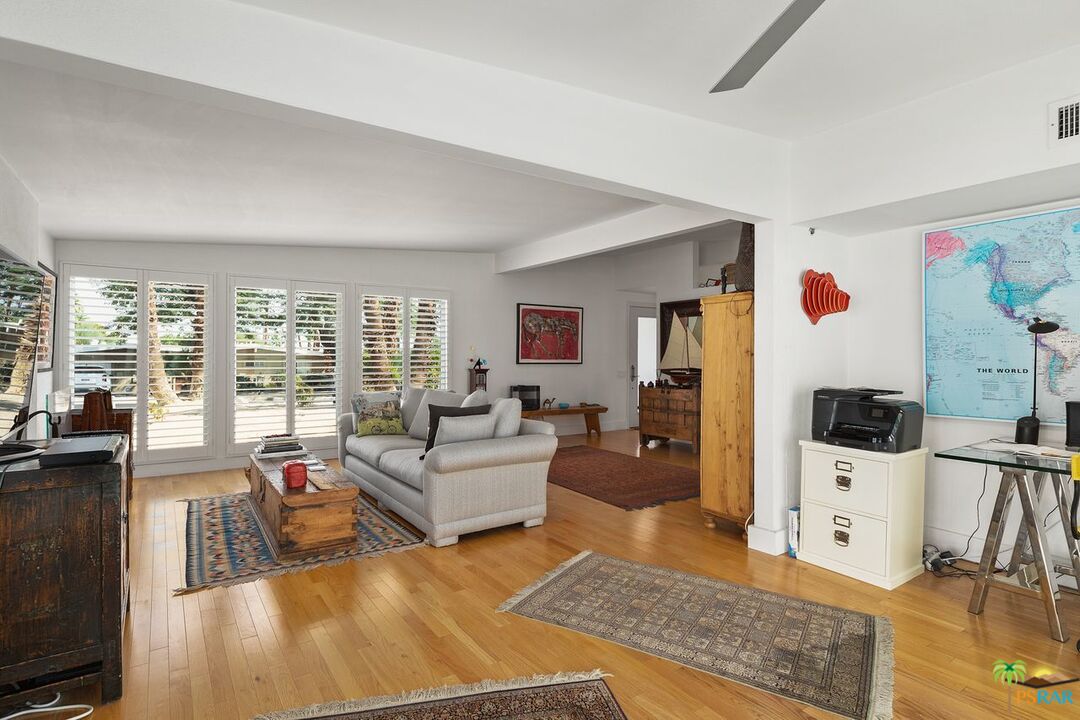 73501 Silver Moon Trail Palm Desert, CA 92260 - Photo 11 of 38 a living room with furniture and a flat screen tv