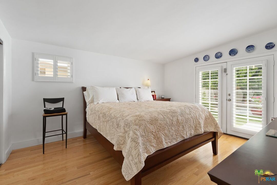 73501 Silver Moon Trail Palm Desert, CA 92260 - Photo 21 of 38 a bed sitting in a bedroom next to a window