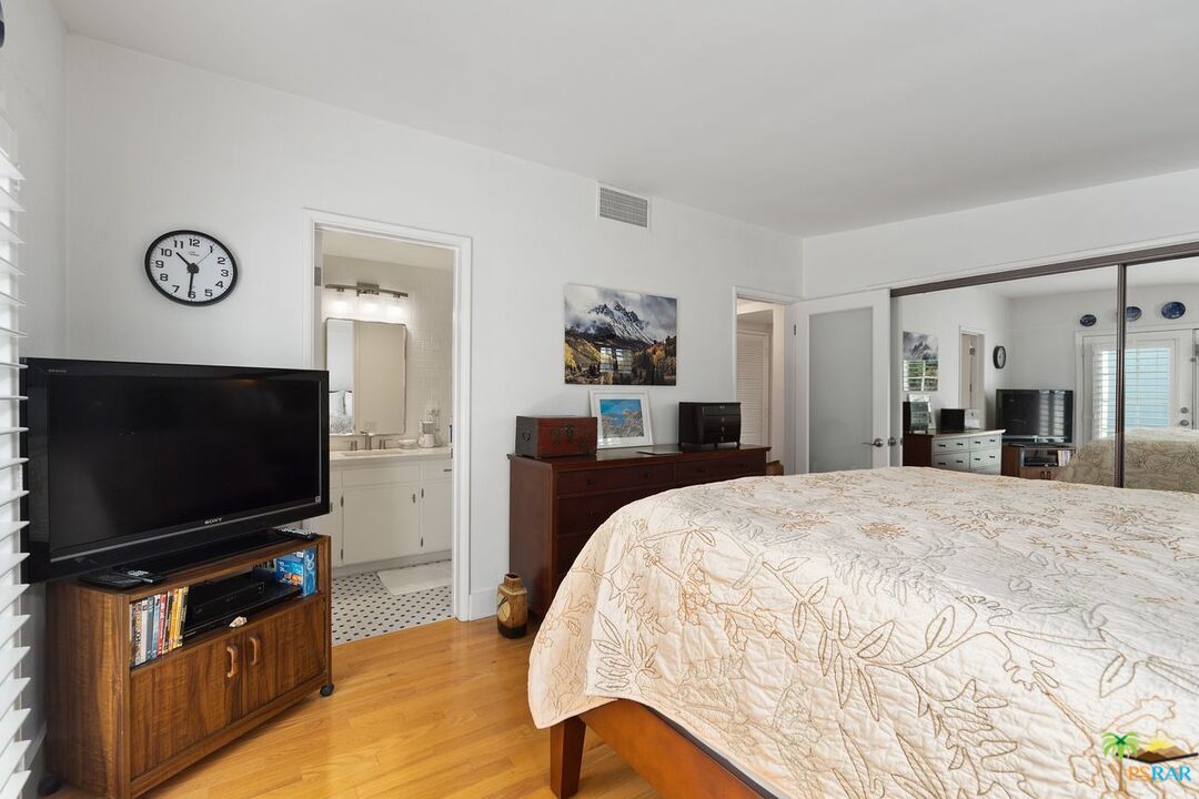 73501 Silver Moon Trail Palm Desert, CA 92260 - Photo 23 of 38 a bedroom with a bed and a flat screen tv