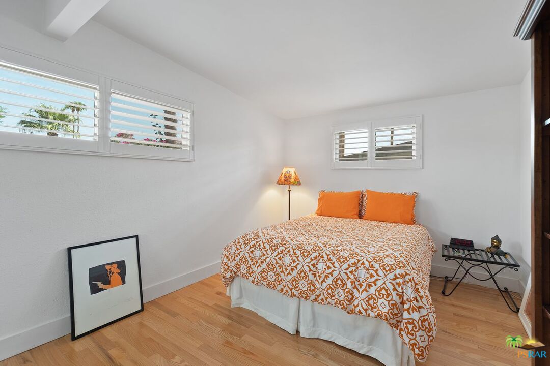 73501 Silver Moon Trail Palm Desert, CA 92260 - Photo 25 of 38 a bedroom with a bed and a table in it