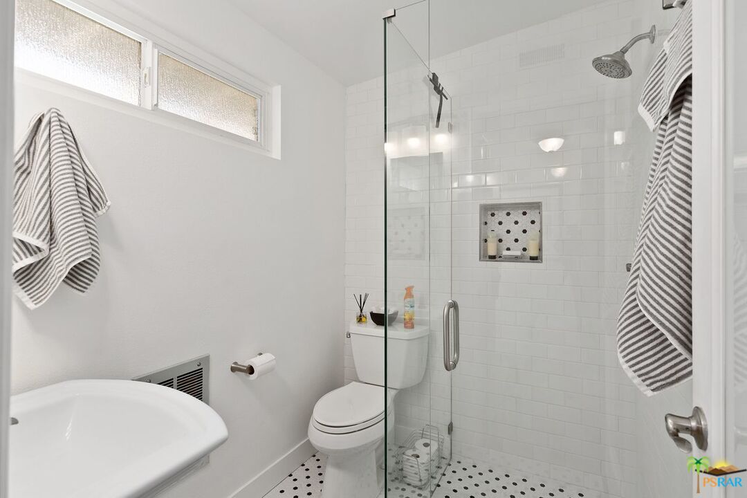 73501 Silver Moon Trail Palm Desert, CA 92260 - Photo 27 of 38 a bathroom with a toilet sink and shower