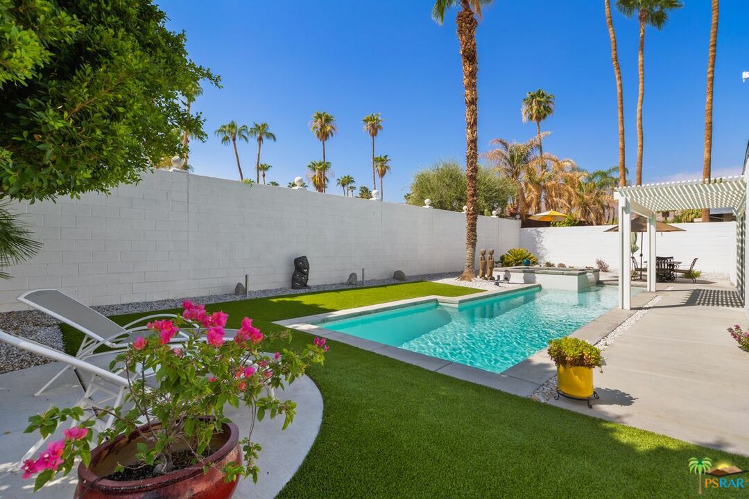 73501 Silver Moon Trail Palm Desert, CA 92260 - Photo 30 of 38 a view of a backyard with swimming pool