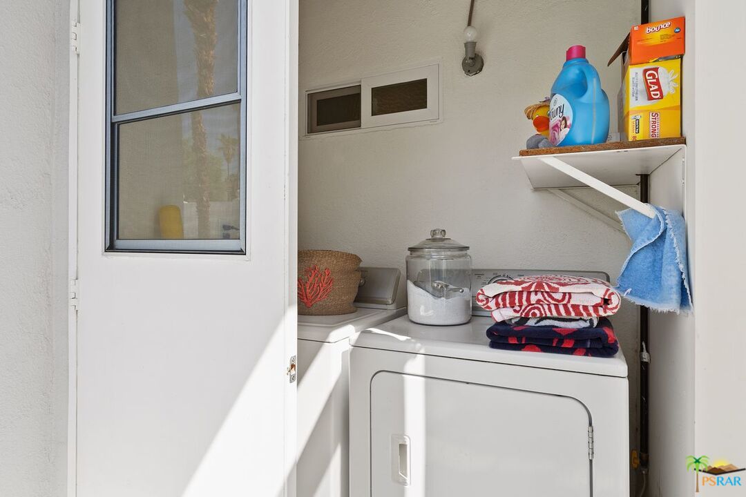 73501 Silver Moon Trail Palm Desert, CA 92260 - Photo 32 of 38 a utility room with dryer and washer
