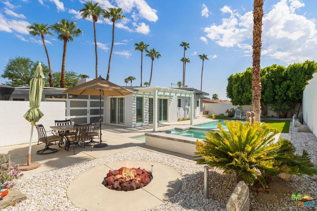 73501 Silver Moon Trail Palm Desert, CA 92260 - Photo 36 of 38 a view of a swimming pool with a patio